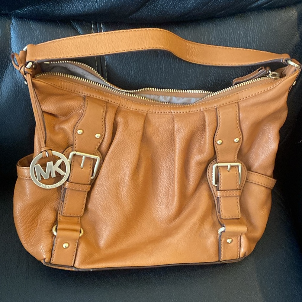 Micheal Kors Dark Tan Shoulder Strap Purse with yellow gold plated accessory